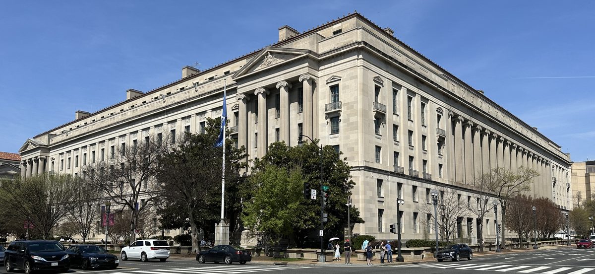 I-220B order of supervision guide illustrated with the Department of Justice building in Washington