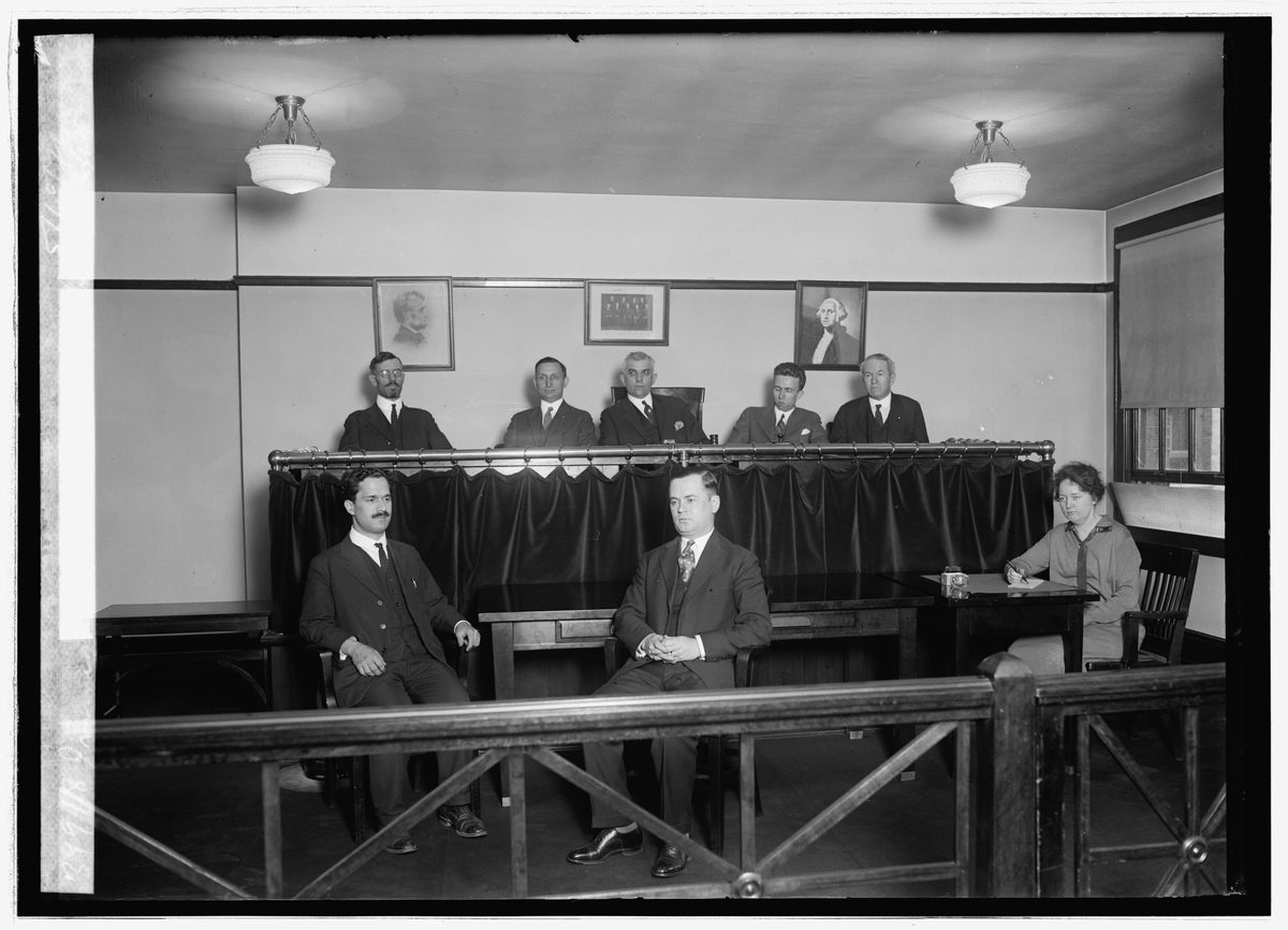 Historic immigration court image showing long-standing administrative warrant and removal process context