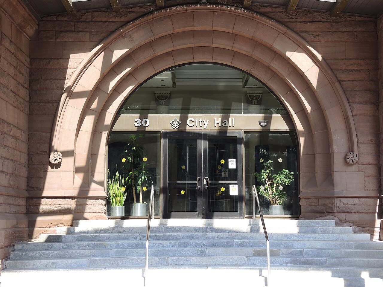 Federal building entrance that reflects the screening and ID checks built into ICE visitation rules