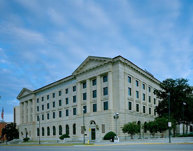 Master calendar hearing in immigration court guide with a federal courthouse exterior tied to first-hearing preparation
