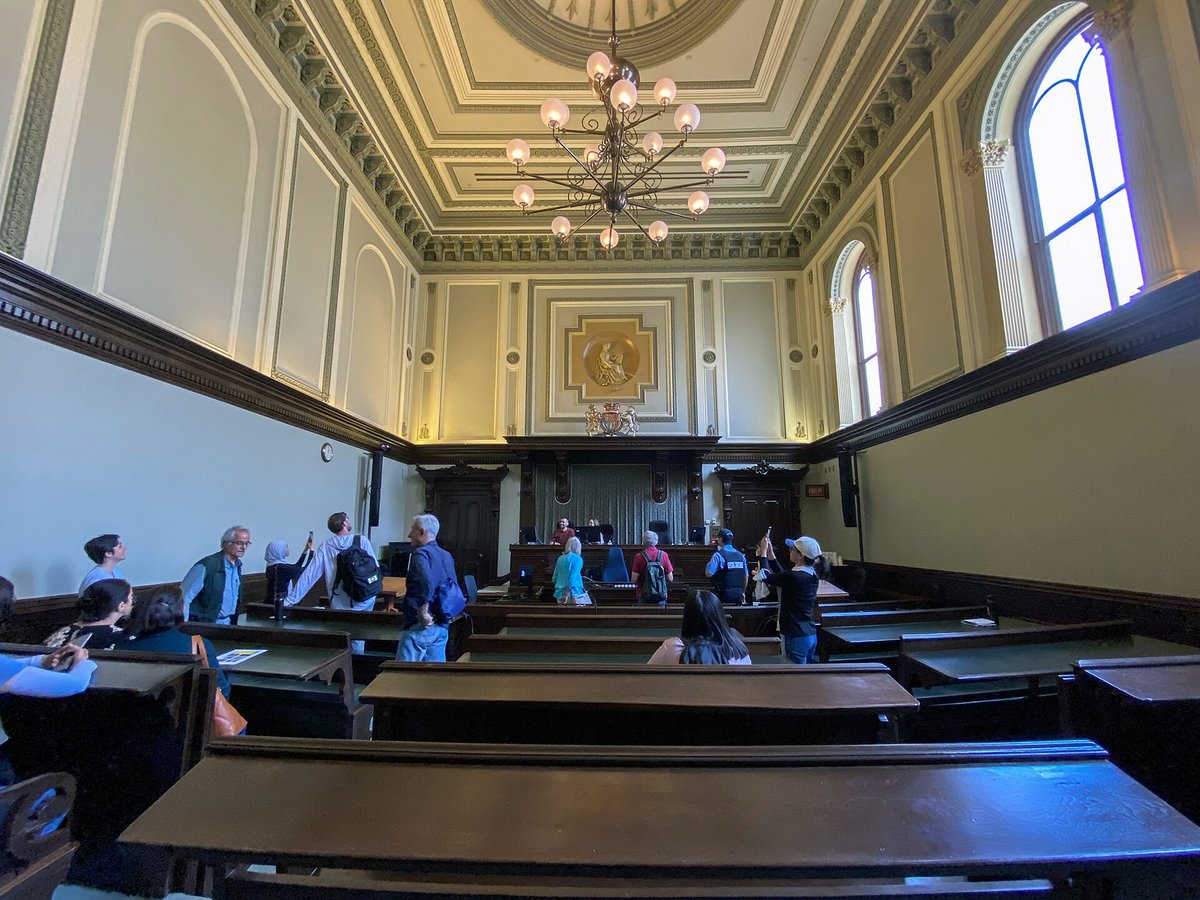 Courtroom interior illustrating motion to reopen in absentia cases after missed immigration court hearings