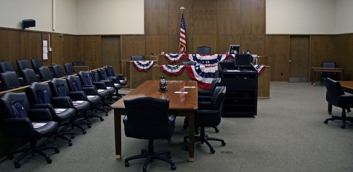 Courtroom interior representing the first hearing after a notice to appear for immigration court
